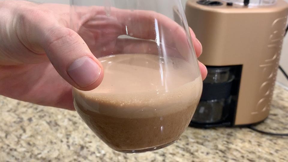 A glass of Chocolate Biohacking Coffee