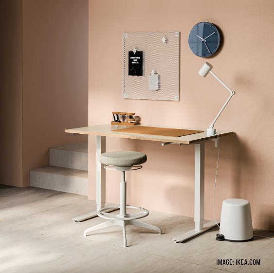 An IKEA Home Office Desk that is height-adjustable for more productivity