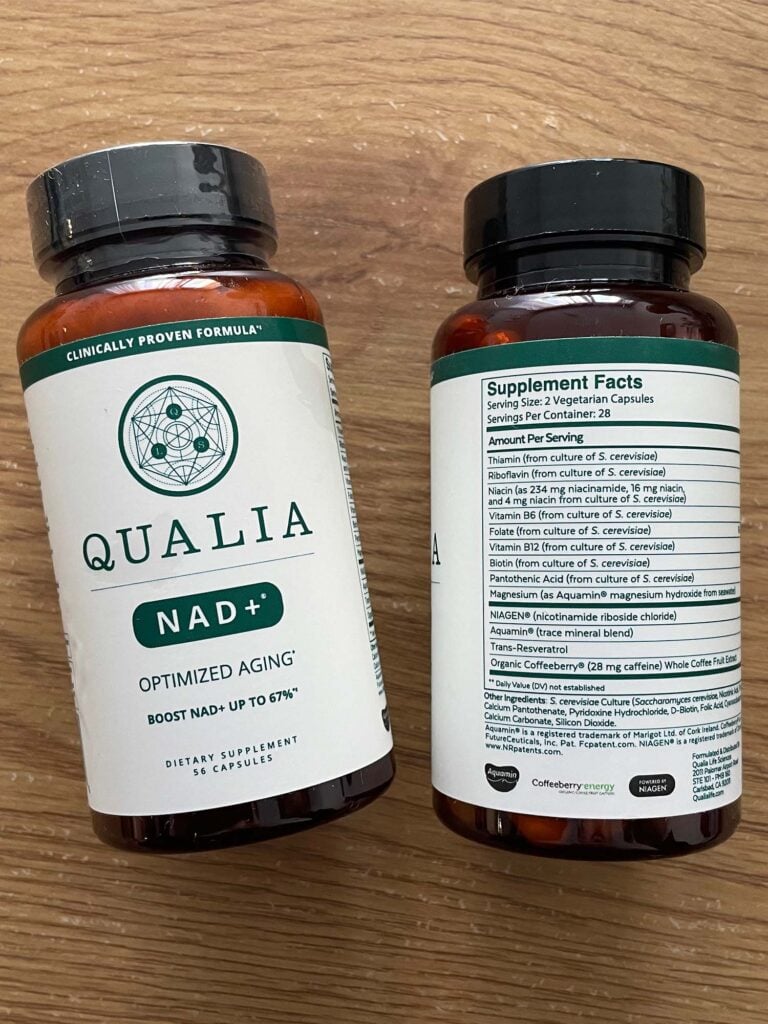 Qualia NAD+ supplement bottles showing product label and ingredient list for boosting NAD+ levels by up to 67%.